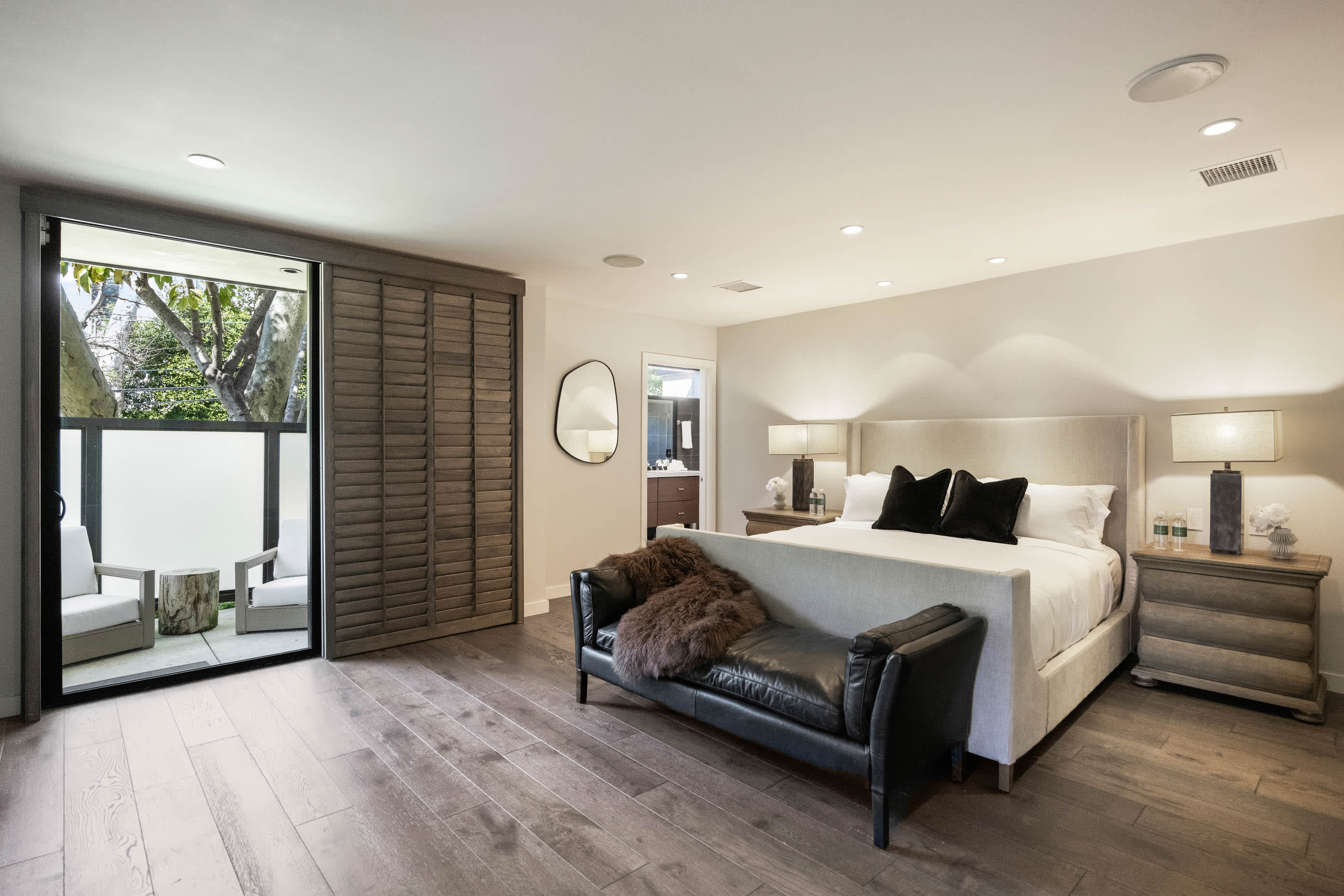 Experience unparalleled luxury in the master bedroom, featuring a spacious layout, plush furnishings.