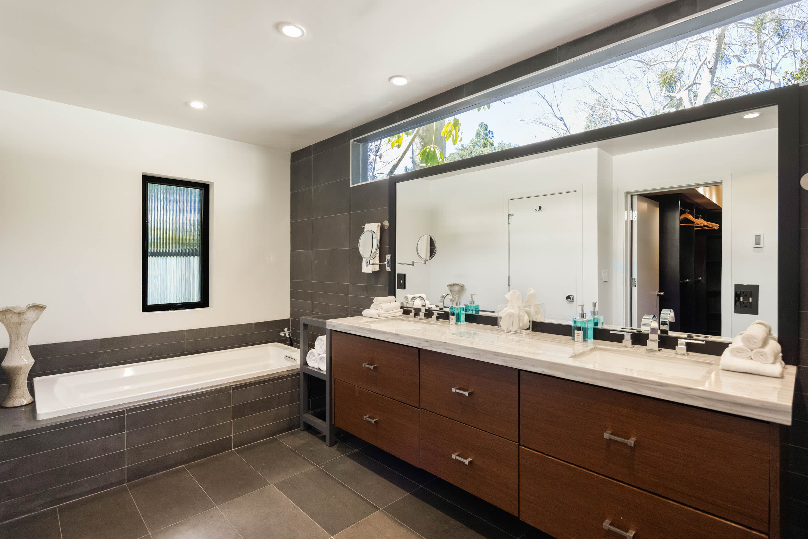 Sink into the spacious, modern bathtub for a luxurious bathing experience in the master bathroom.