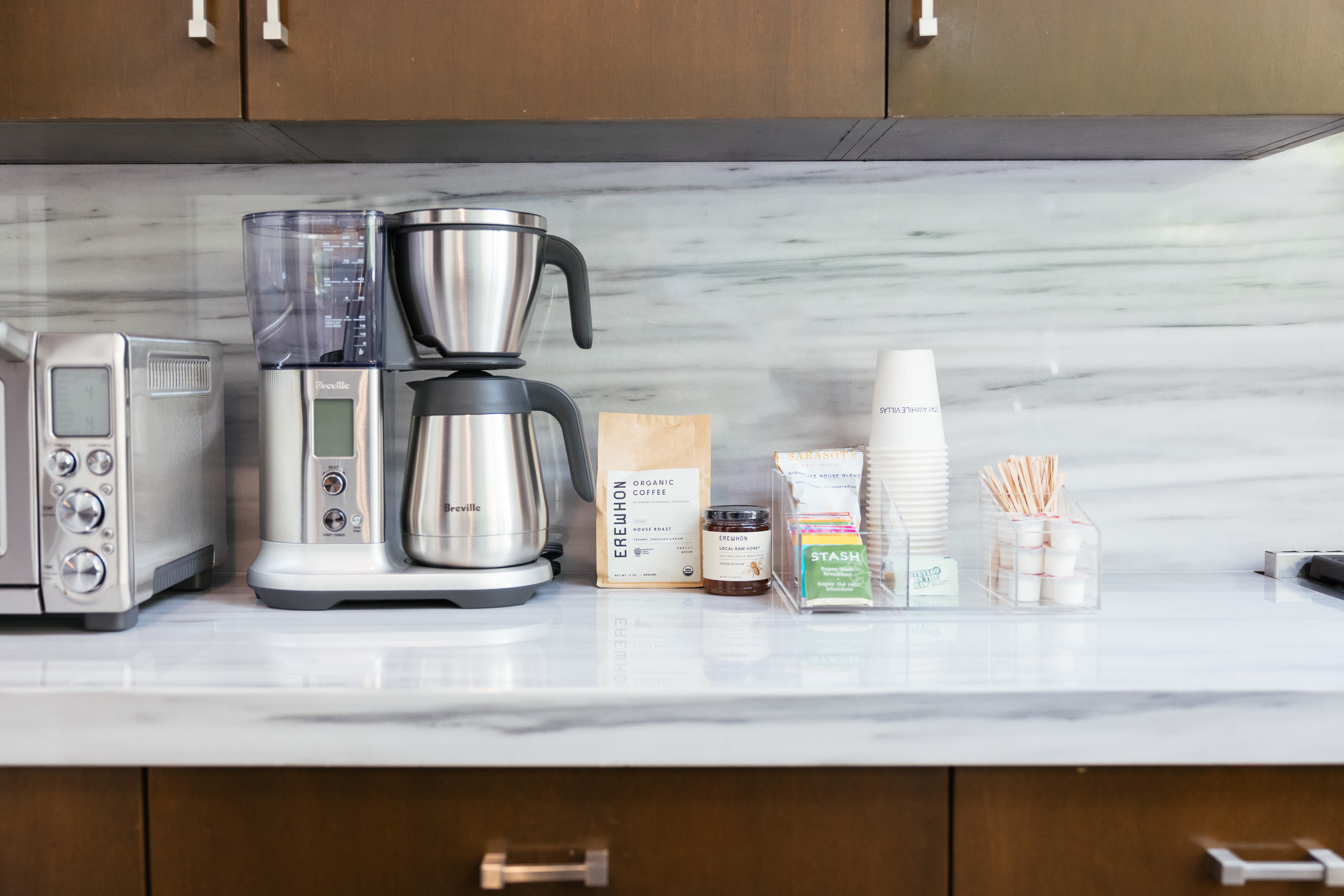 Delight in our selection of artisanal coffee and premium teas, accompanied by a top-of-the-line coffee maker, ensuring you have everything you need for the perfect cup every time.