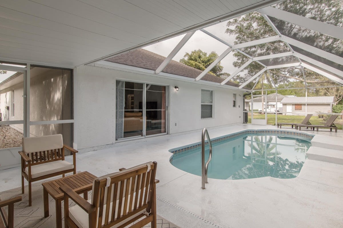 Lounge by the pool and enjoy the outdoor seating area.
