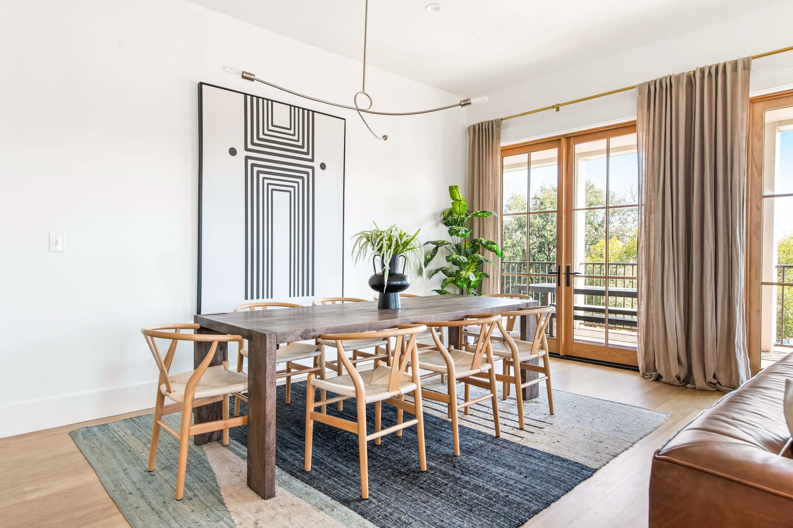 Spacious dining area for 8 guests with an additional 6 seats at the island