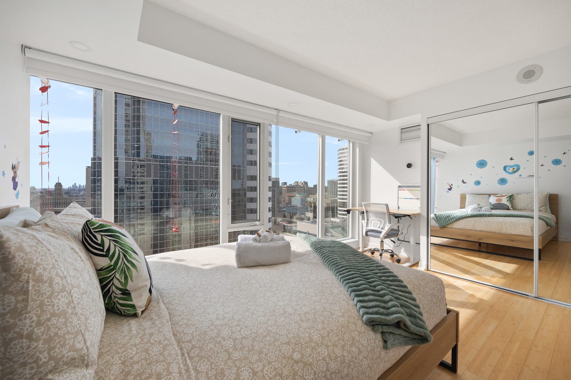 Bask In Natural Light In This Queen Bedroom With Expansive Windows