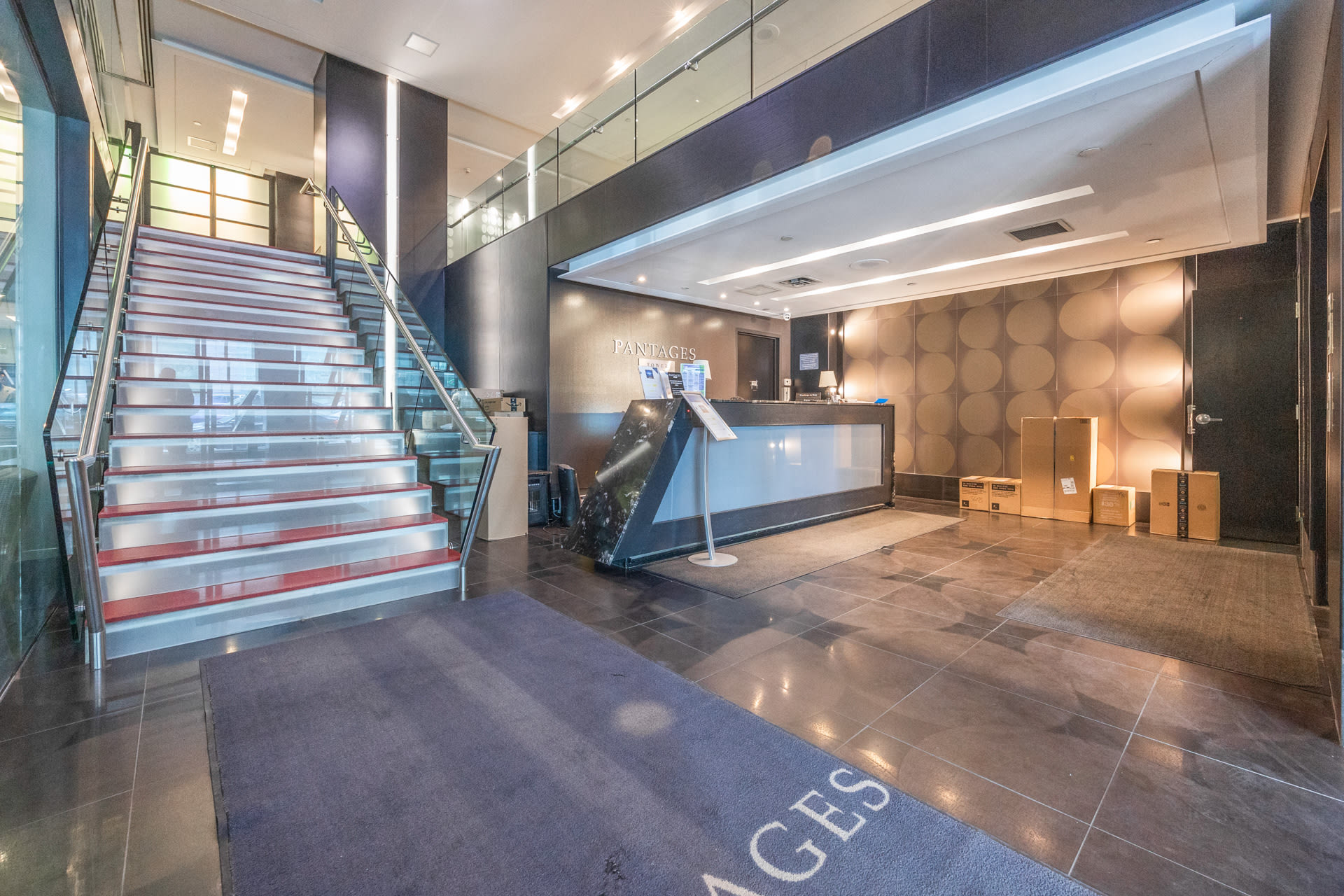 Welcoming Lobby With Elegant Stairs And Stylish Architecture