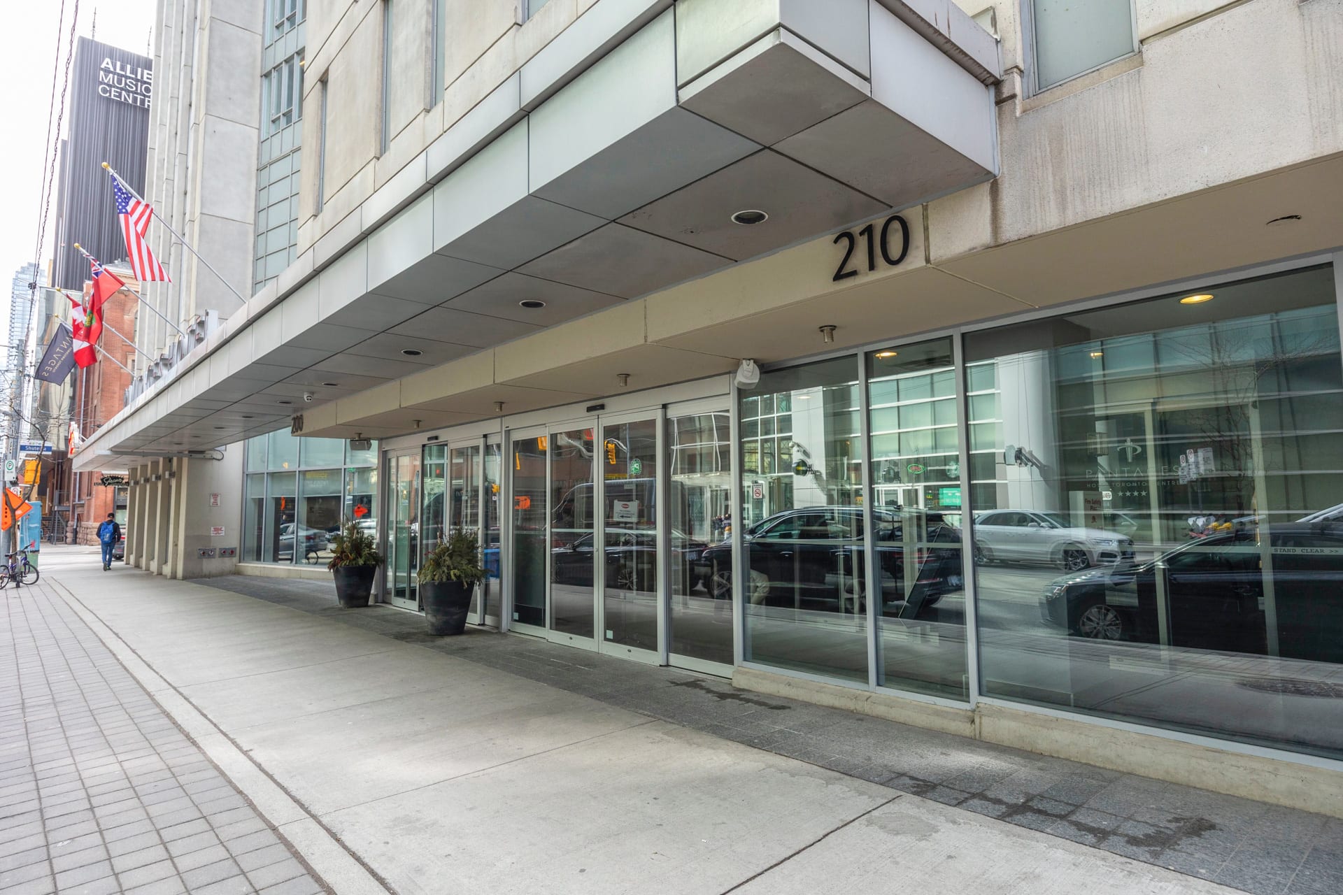 Sleek Exterior Of The Building With Ample Glass Frontage
