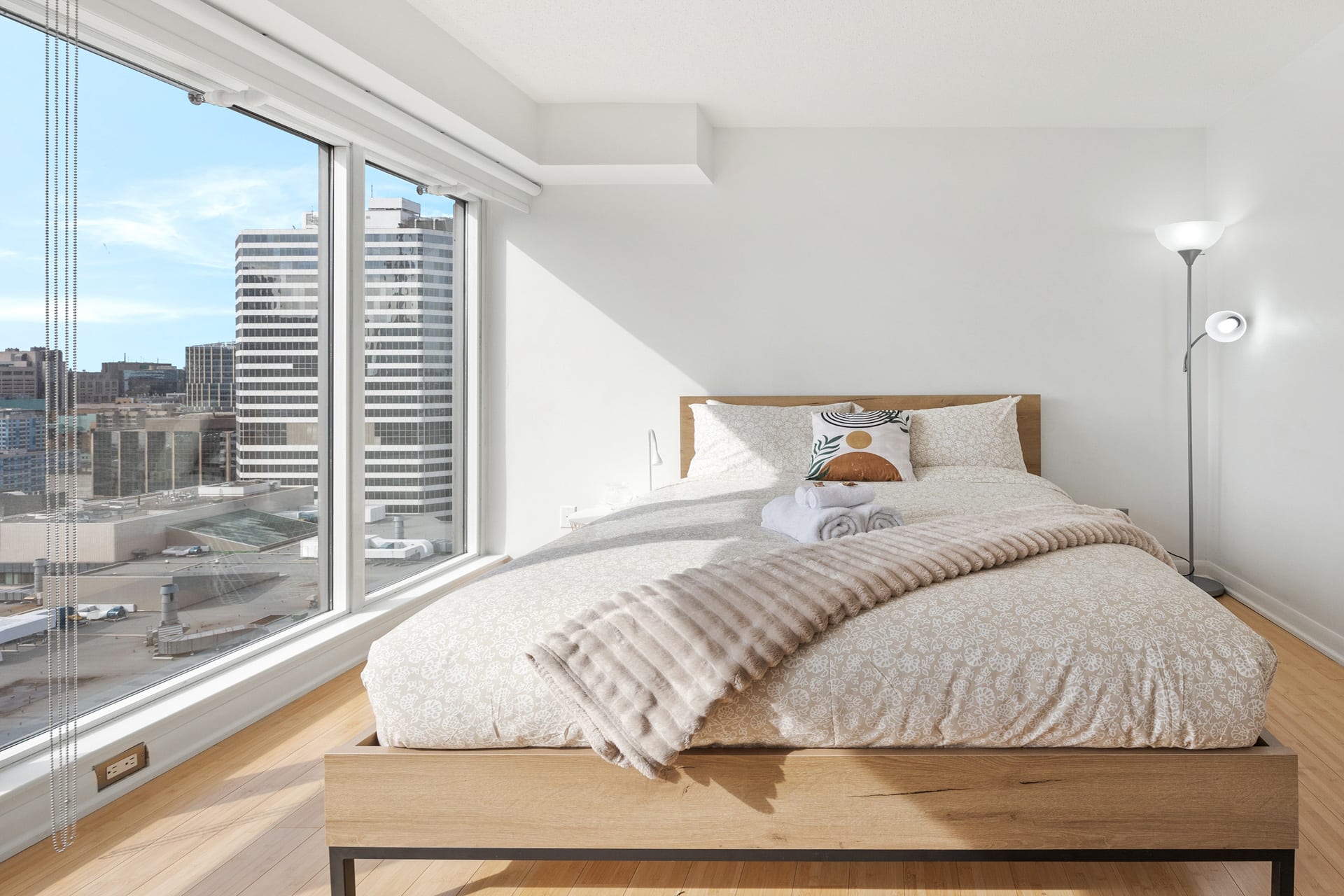 Stunning queen bedroom with large glass windows 
