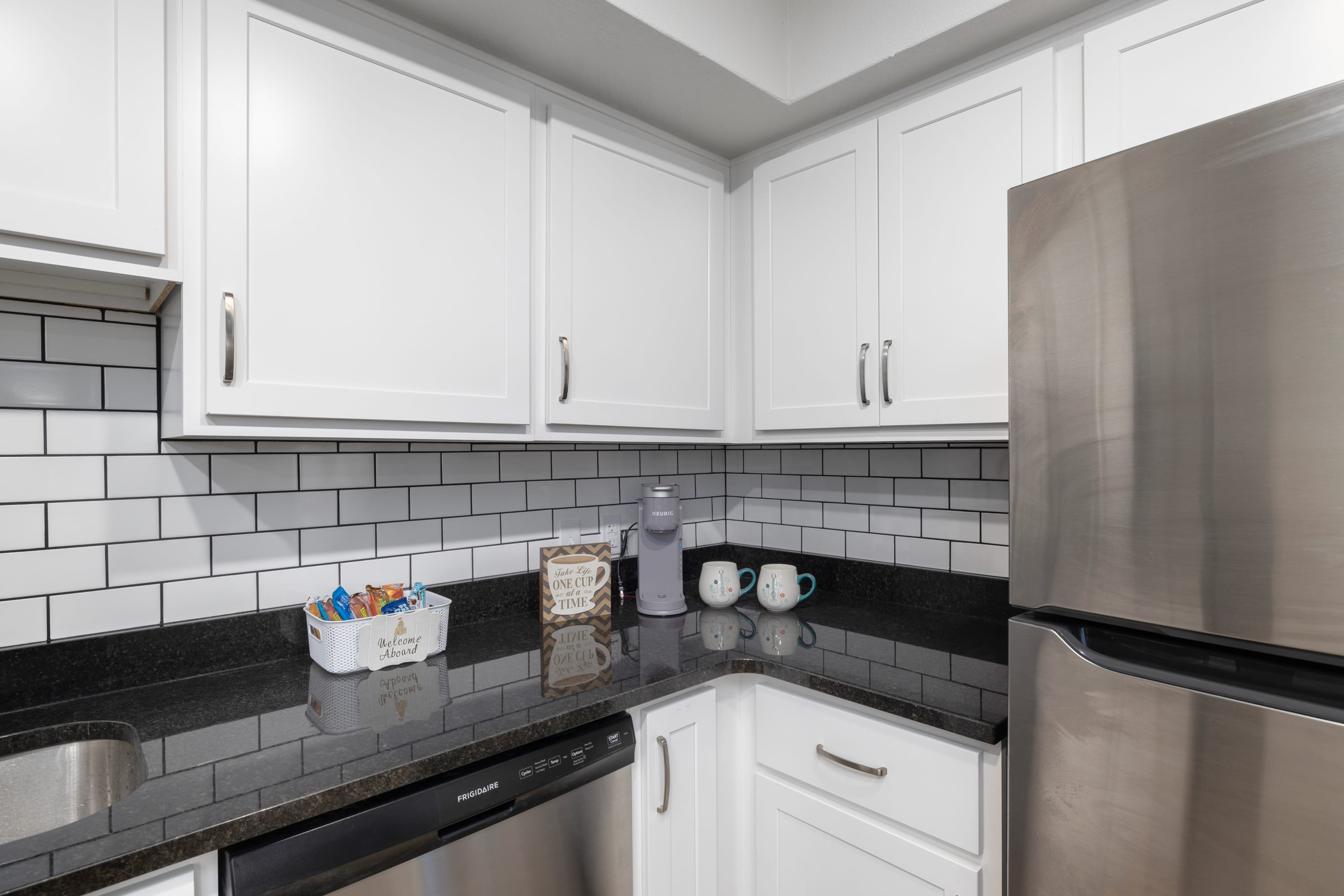 Grab your morning coffee from the coffee station with Keurig coffeemaker and coffee supplies.