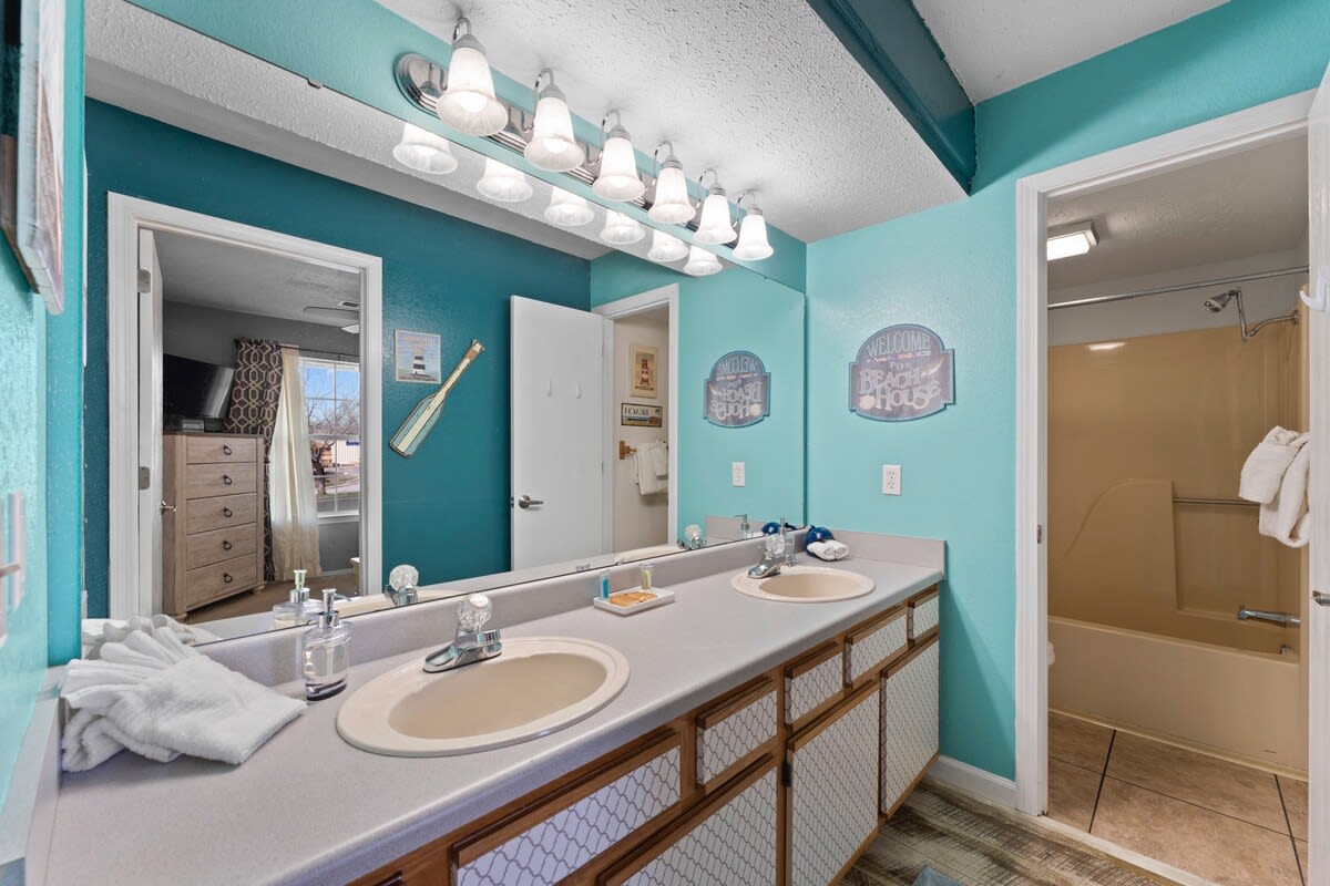 Double vanity along with tub and shower