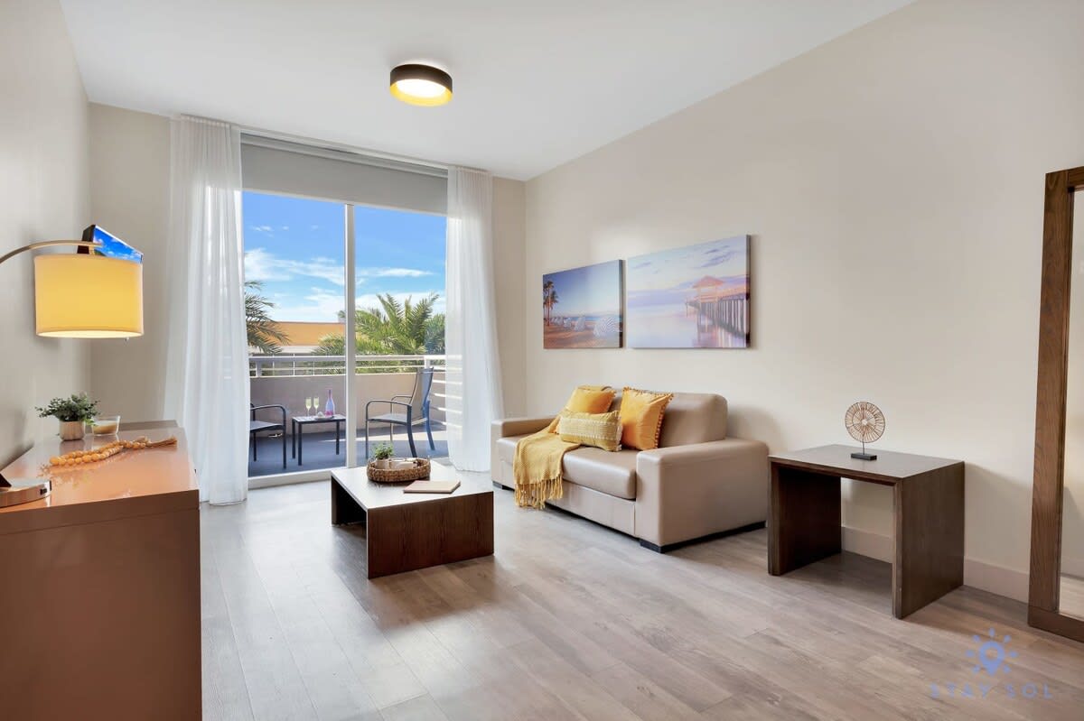 Resort Condo • Balcony • Rooftop Pool & Gym