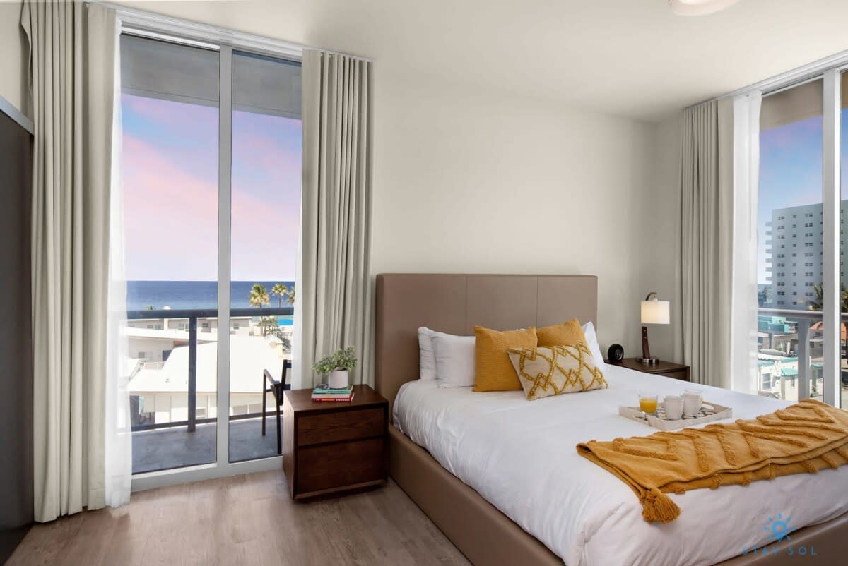 Relax by the Coast: Balcony + Rooftop Pool