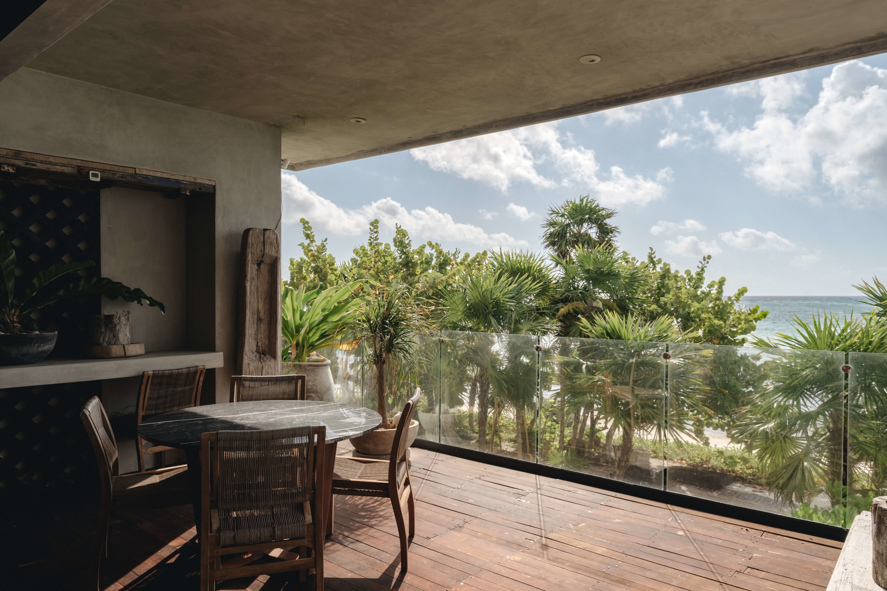 Private balcony with ocean view and outdoor dining area