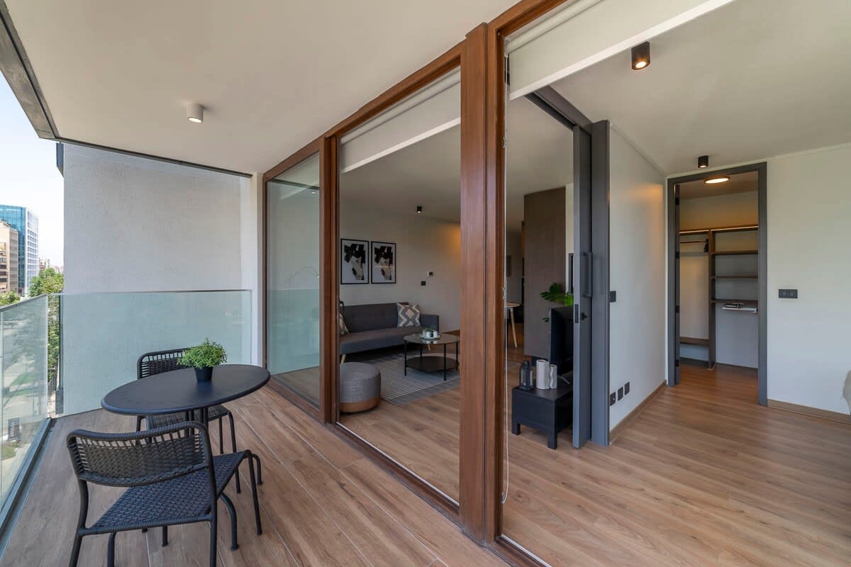 Enjoy city views from your private balcony, perfect for morning coffee or evening relaxation in this stylish studio apartment.