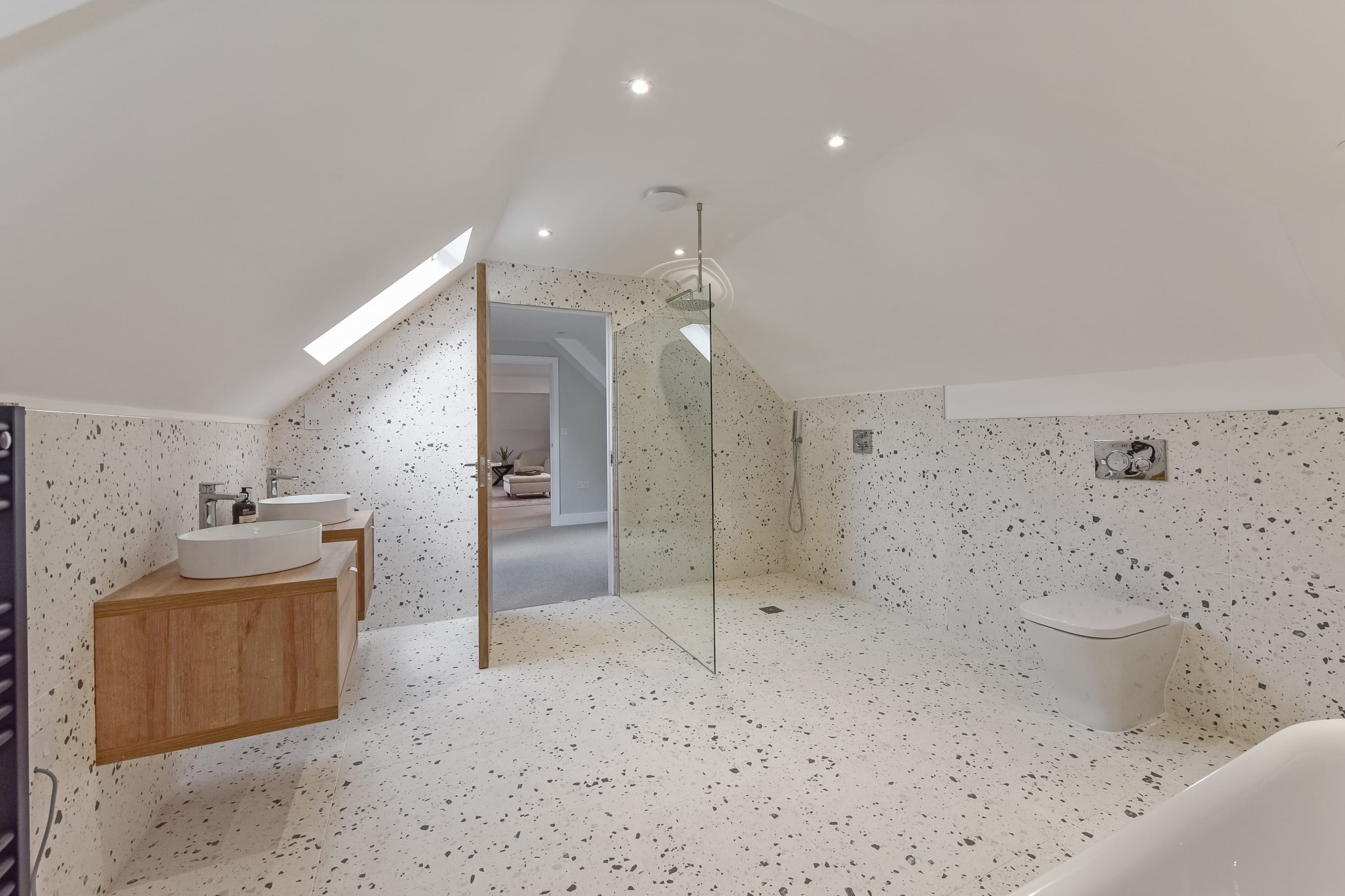 A bathroom with his & hers sinks.