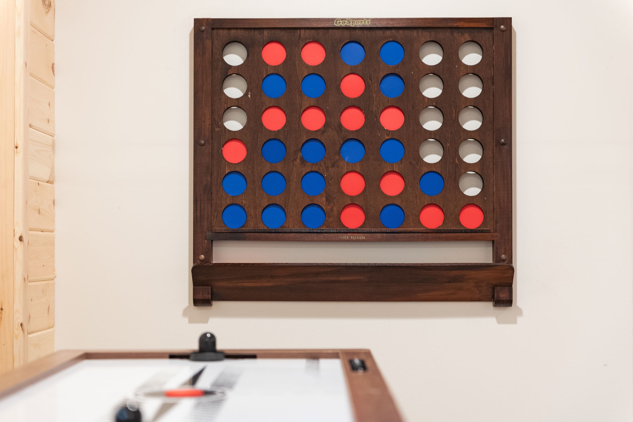 A unique and playful touch, this oversized wall-mounted Connect Four game is perfect for all ages.
