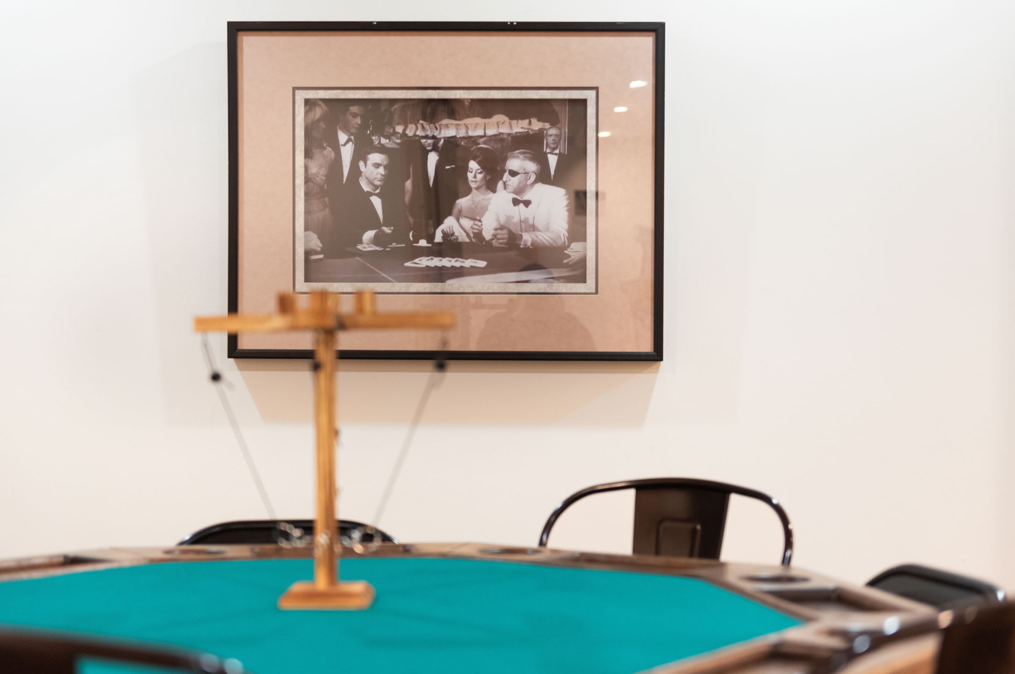 A poker table ready for game night, set against a backdrop of vintage decor that enhances the cozy cabin ambiance.