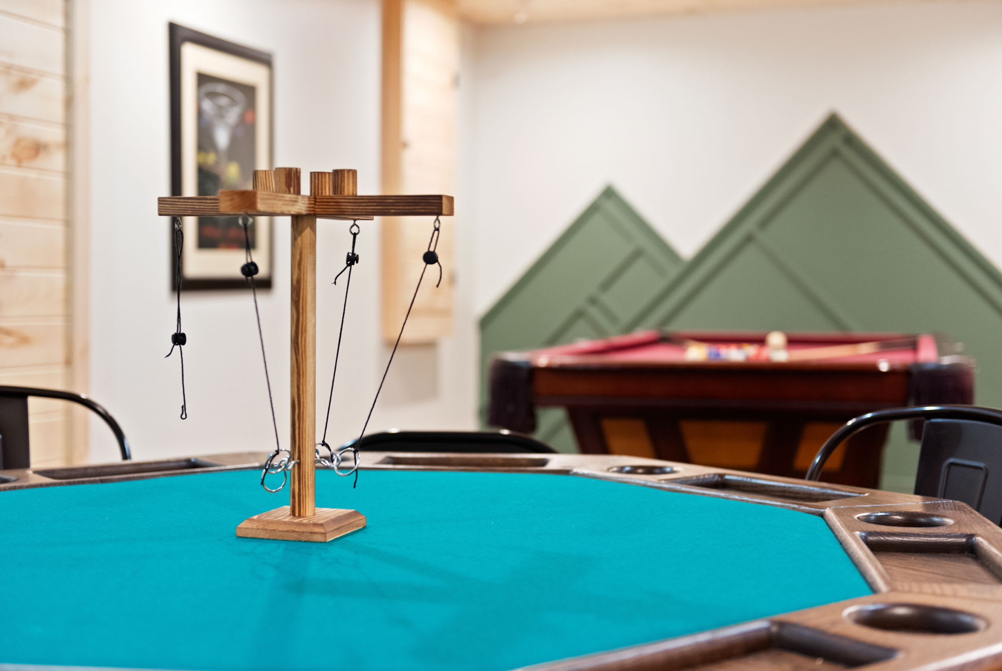 This entertainment space is designed for fun! Whether you're up for a round of poker, a game of pool, or testing your skills with this unique tabletop challenge, there’s something for everyone.