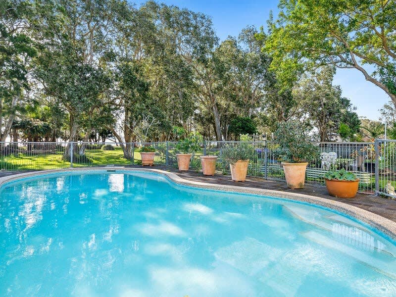 luxurious resort-style in-ground pool and a fenced backyard, there’s plenty of room to splash about or throw the footy around.