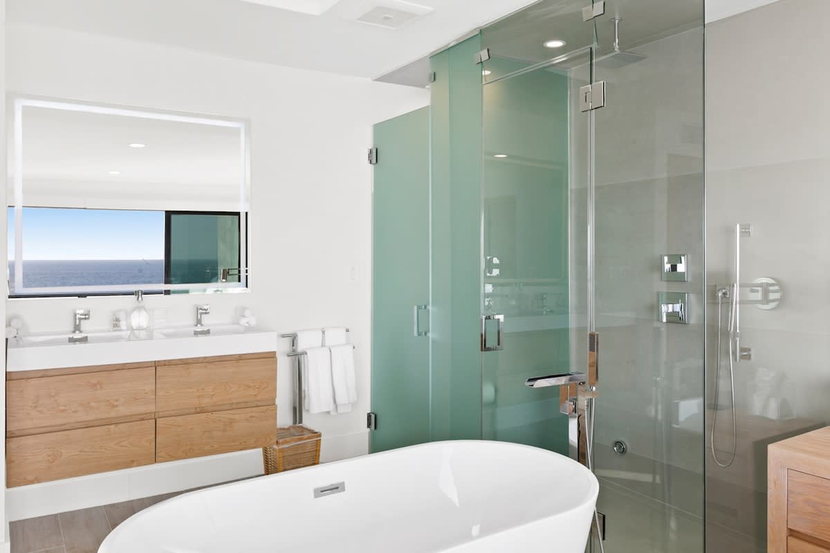 Stand alone tub and rain shower with Kohler hardware