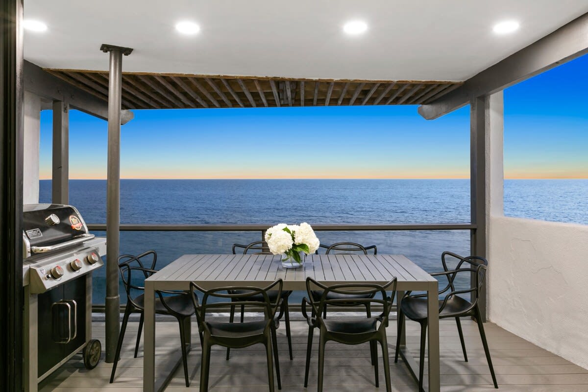 Outdoor dining area with grill