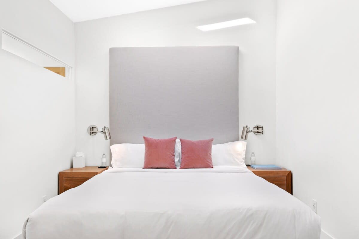 Custom made bed with custom sconces