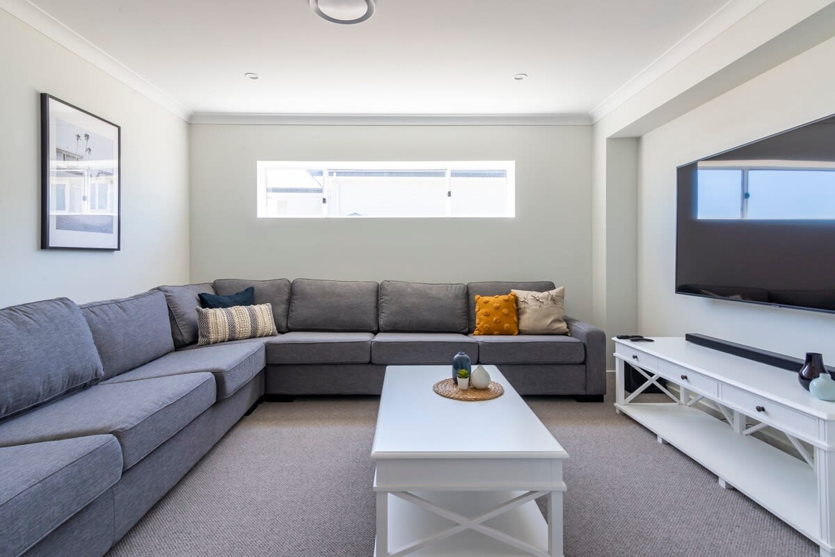 Chill out lounge spaces with plenty of room for everyone and Smart TV's set up with Netflix so you can bing watch your favorite show after a day at the beach