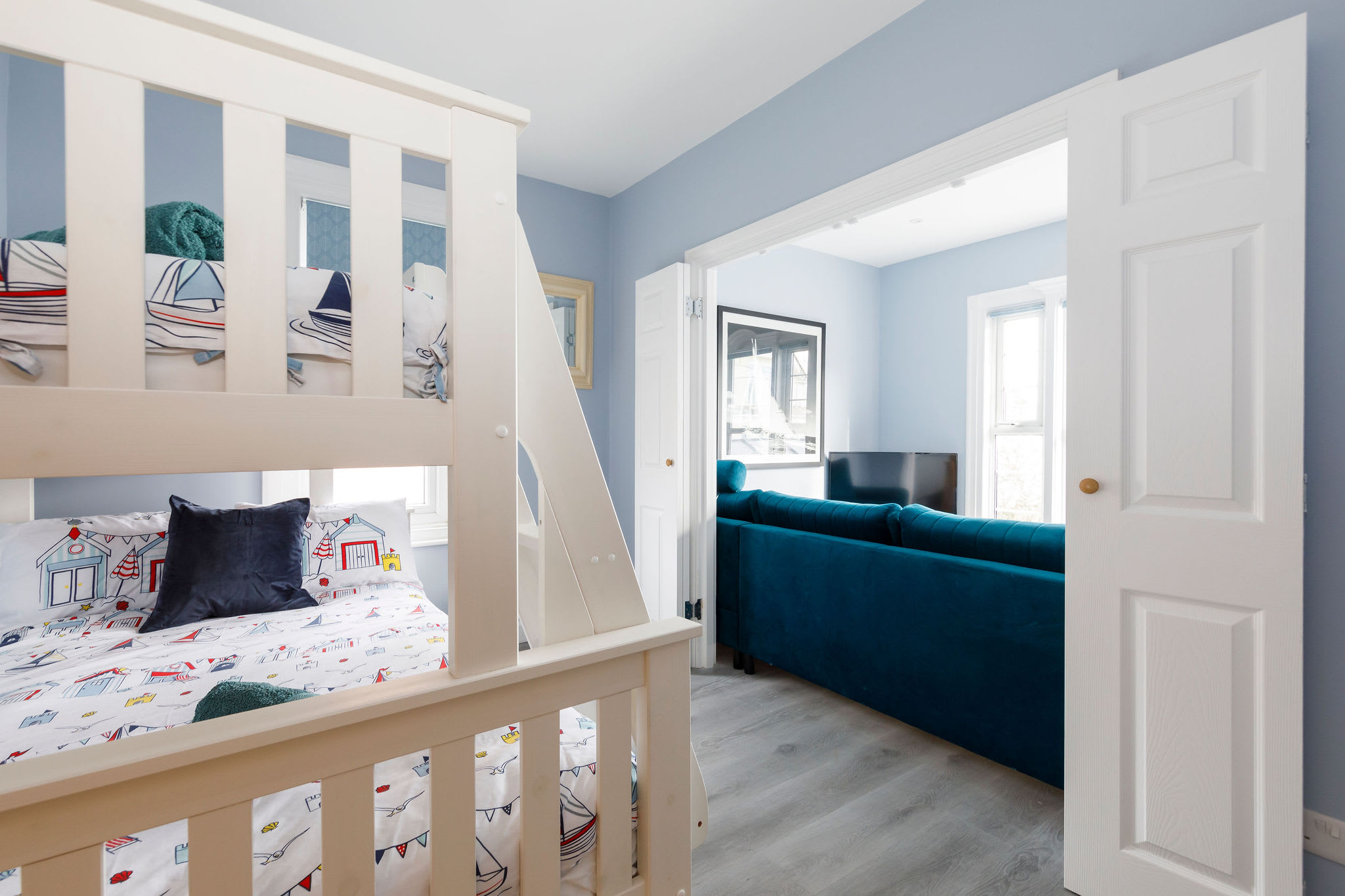 You can open the doors from the second bedroom to the lounge so you can wake up to those sea views!