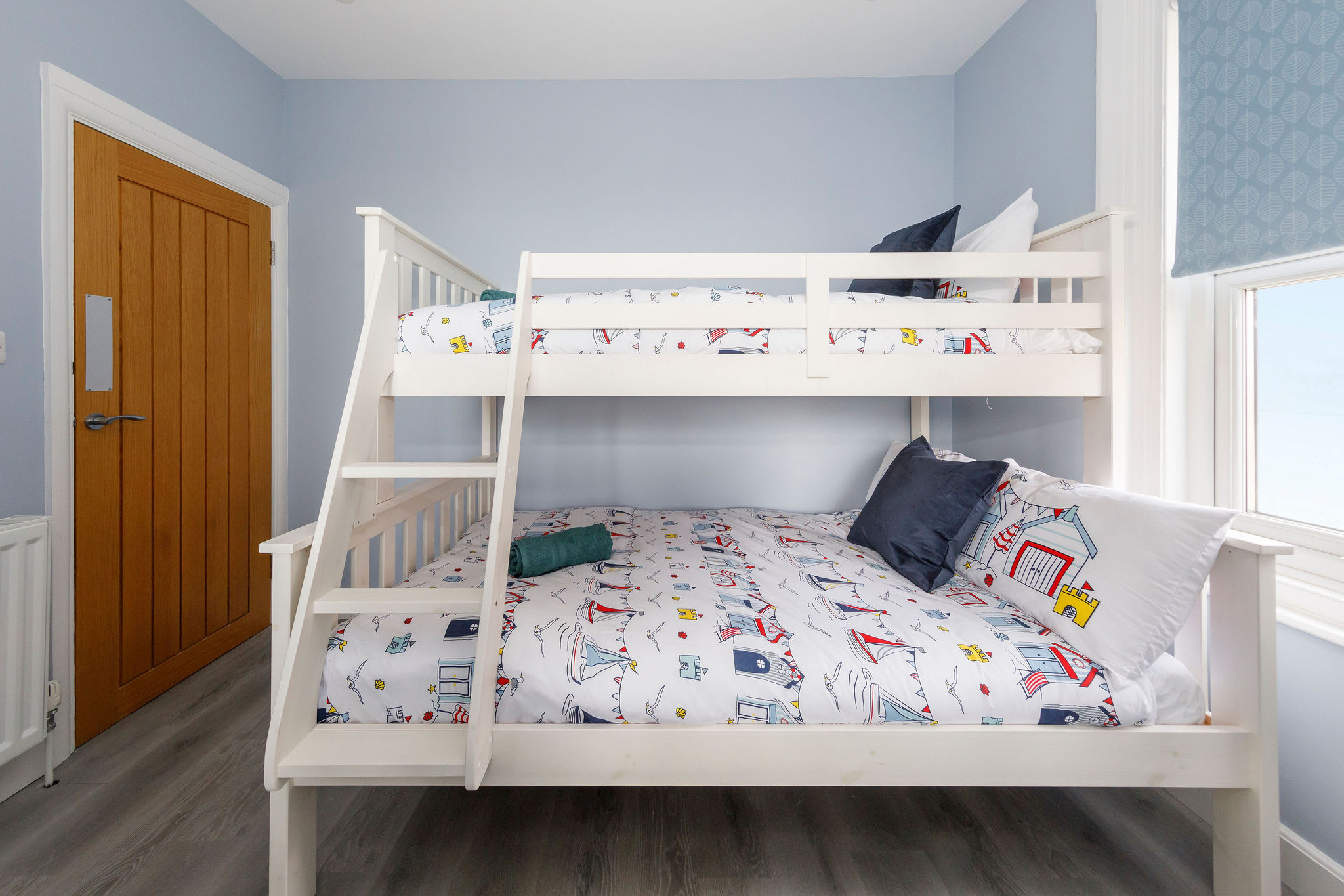 Family Fun: Cozy Up in Our Playful Triple Sleeper Room