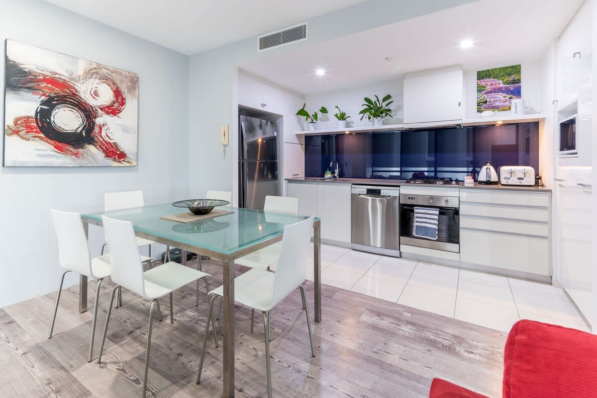 Eat in an open-plan dining and kitchen equipped with top of the line appliances