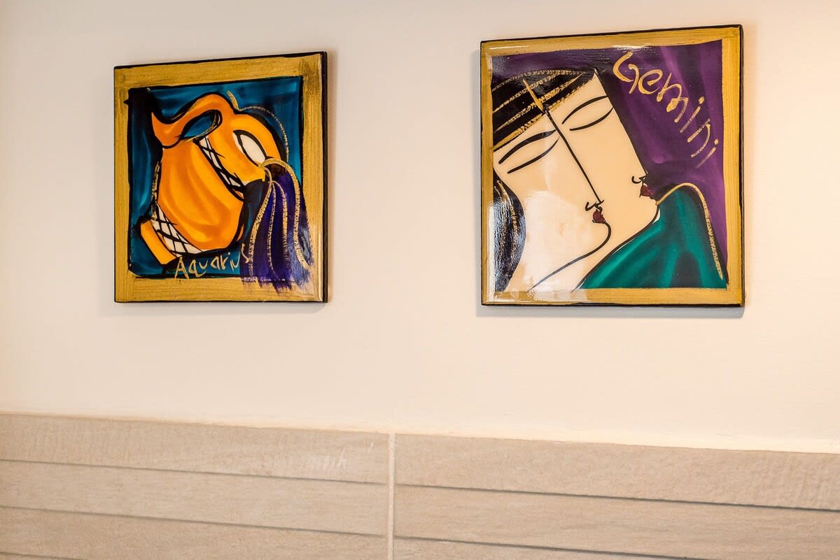 Modern artworks surround the property