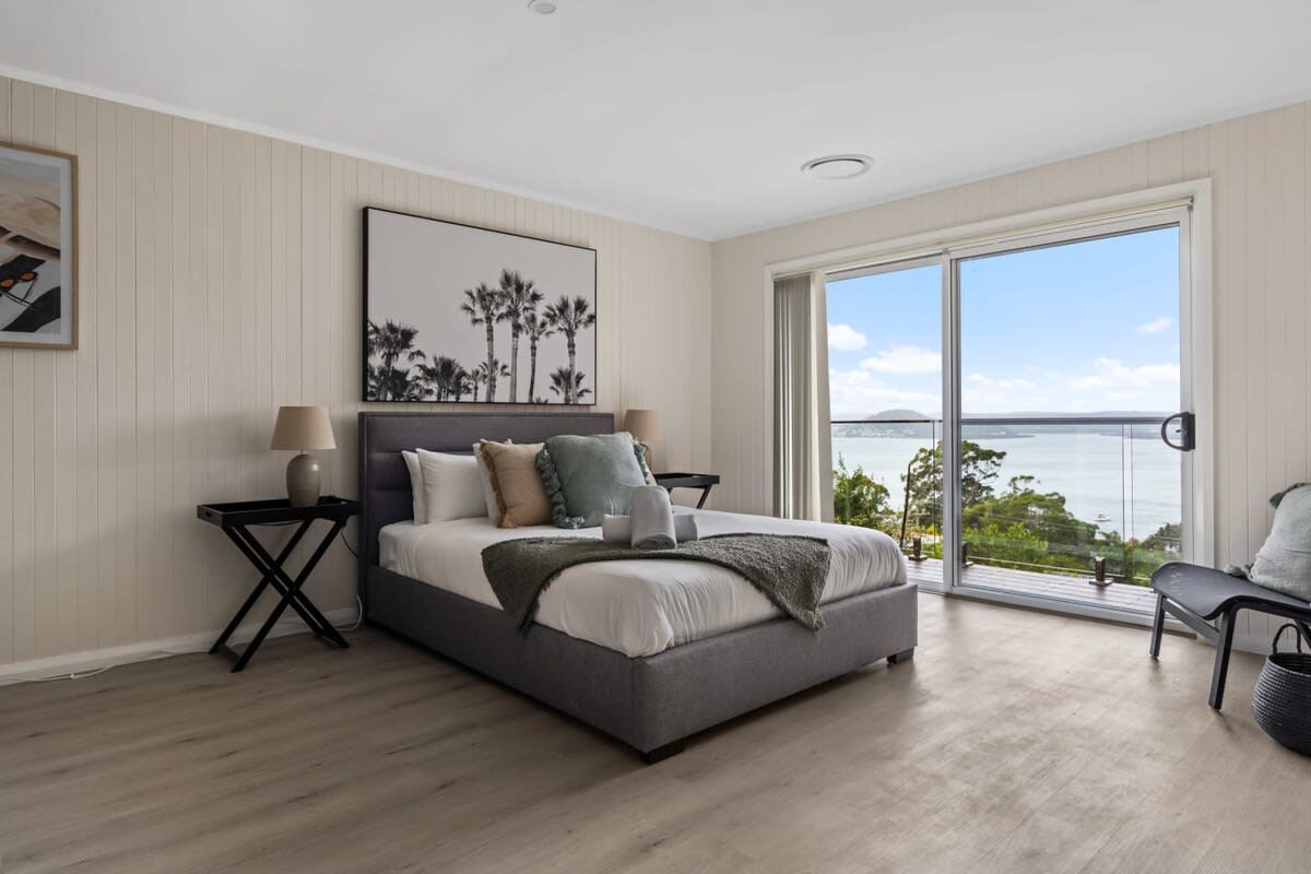 The main bedroom is a true haven, boasting picturesque views of the lake that will leave you breathless