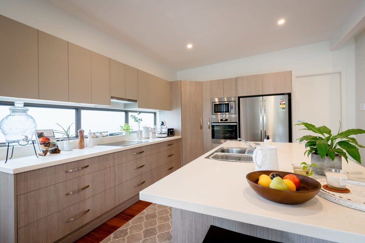 The kitchen is a chef's dream, equipped with top-of-the-line appliances and sleek countertops.