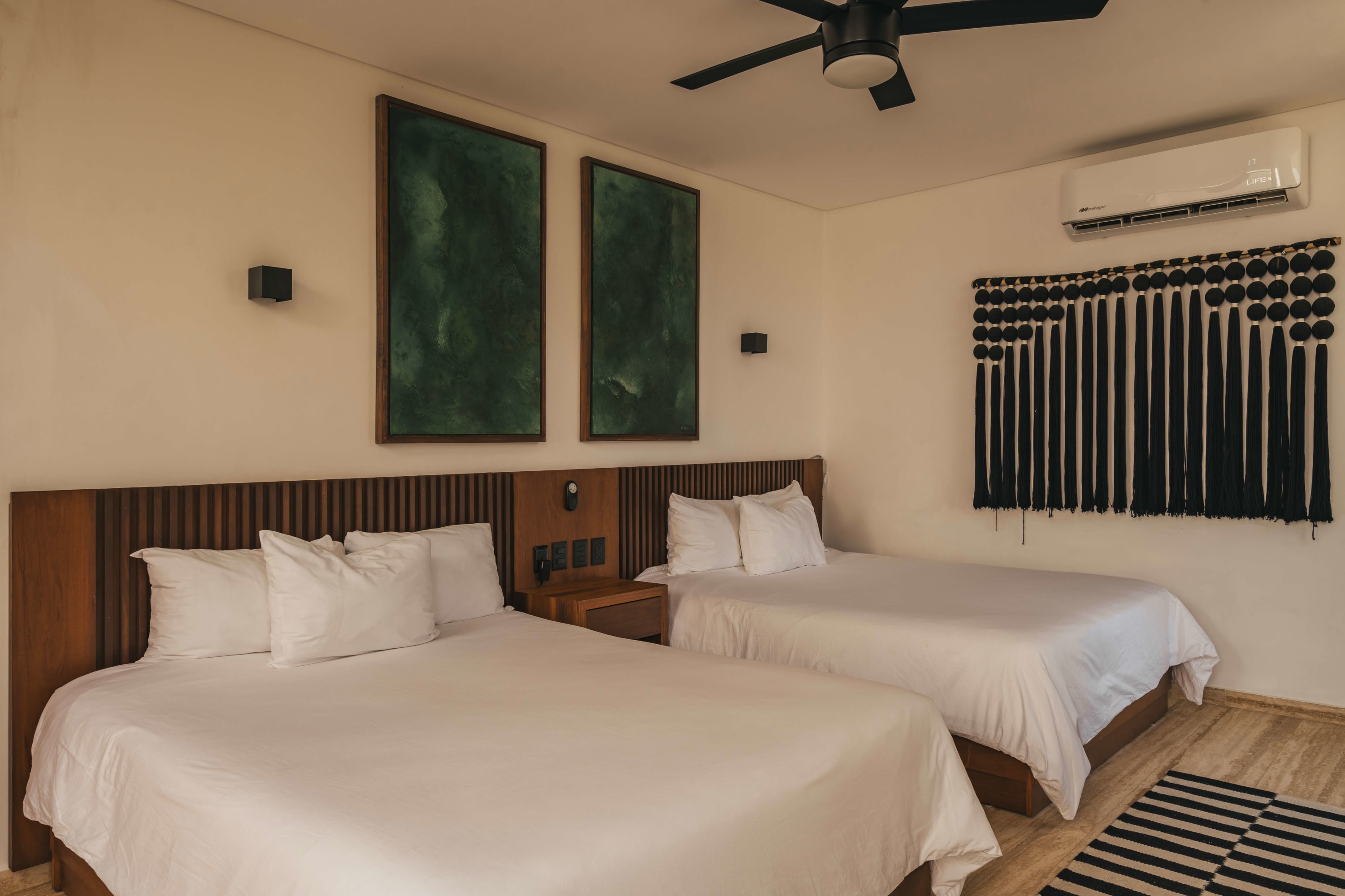 Room with two double beds.