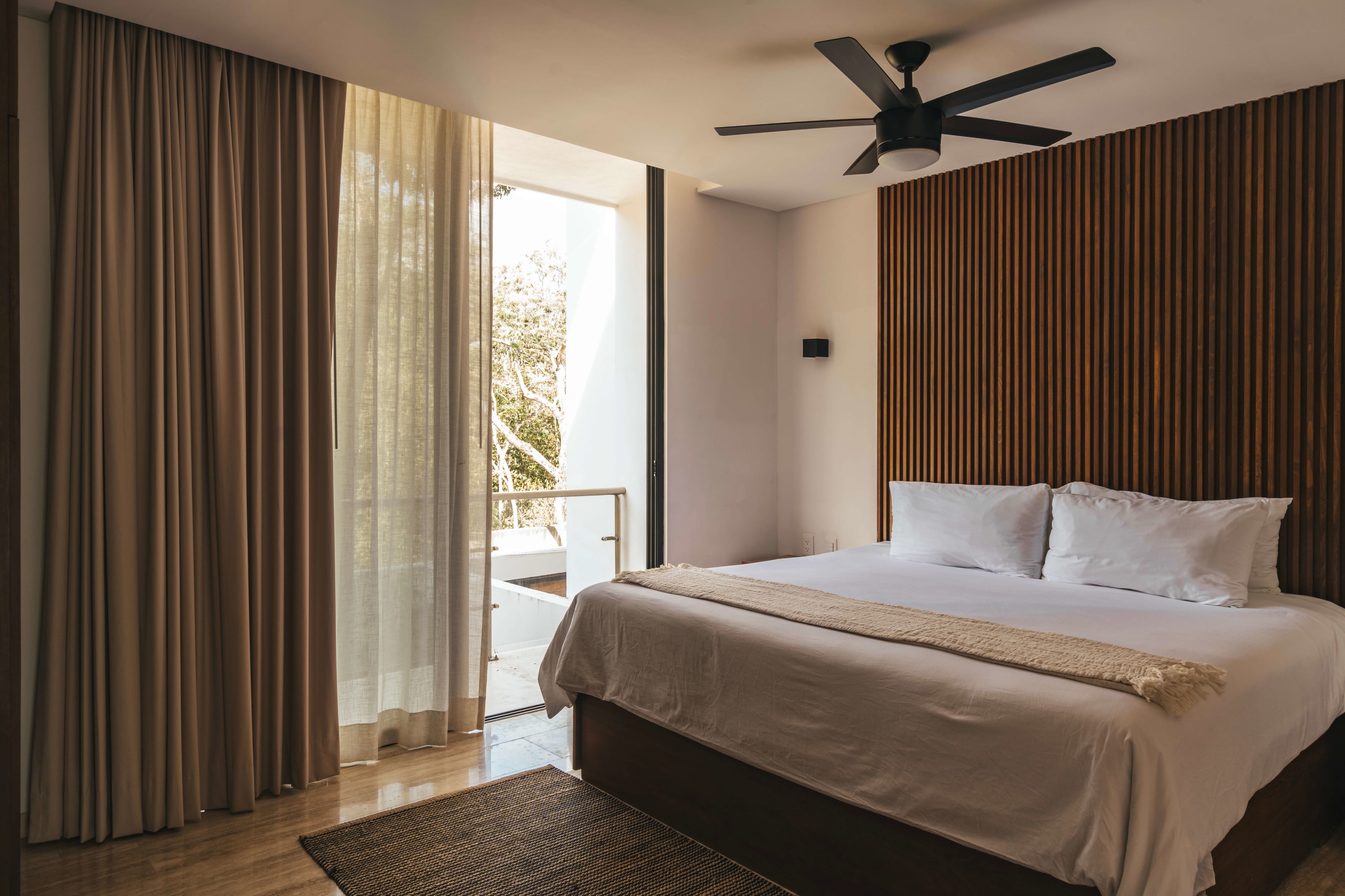 Spacious bedroom with a king-size bed.