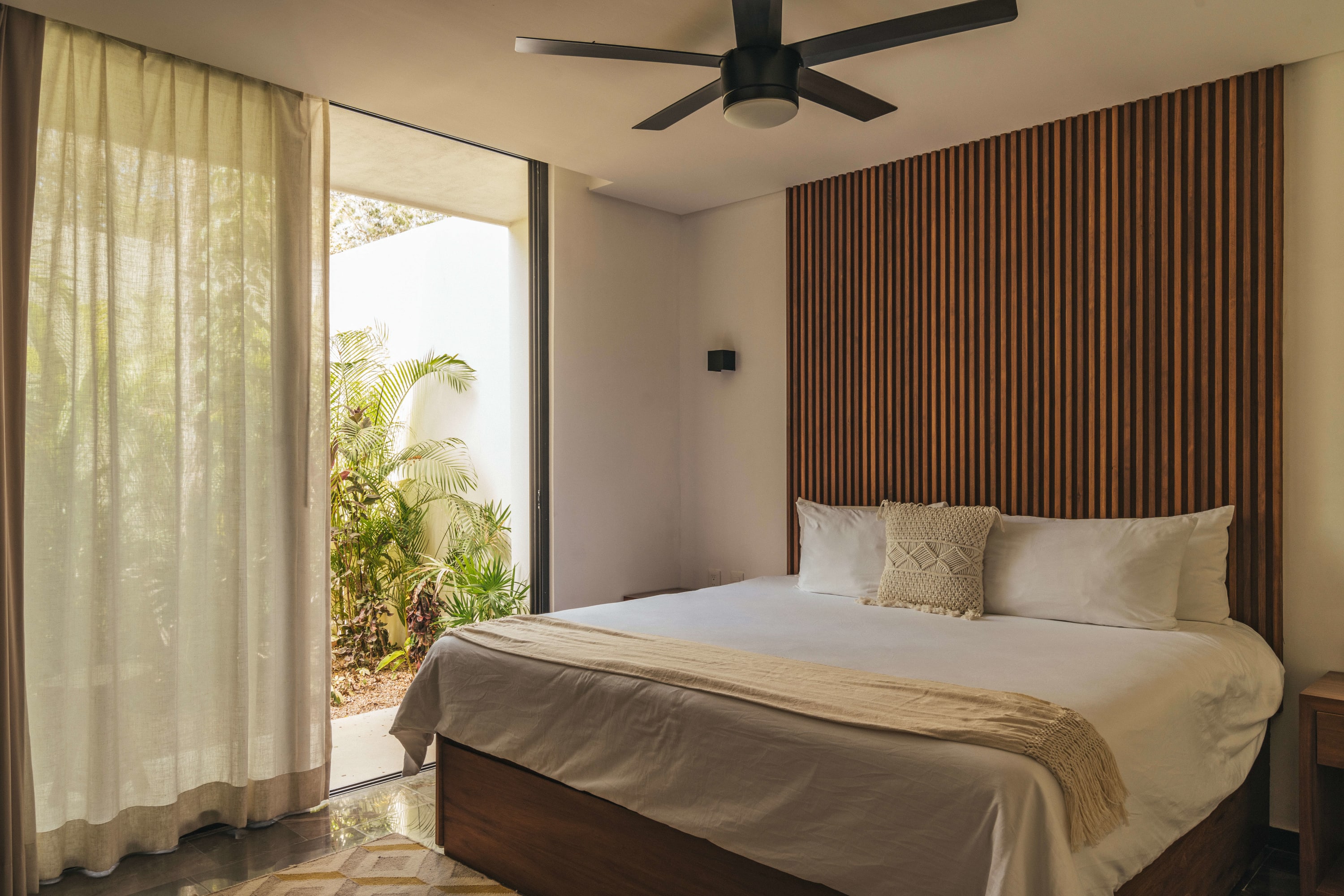 Spacious brbedroom with a king-size bed.