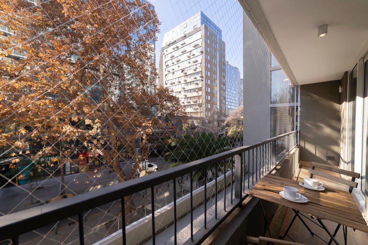 Enjoy your morning coffee on this charming balcony with city views, perfect for a relaxing start to your day.