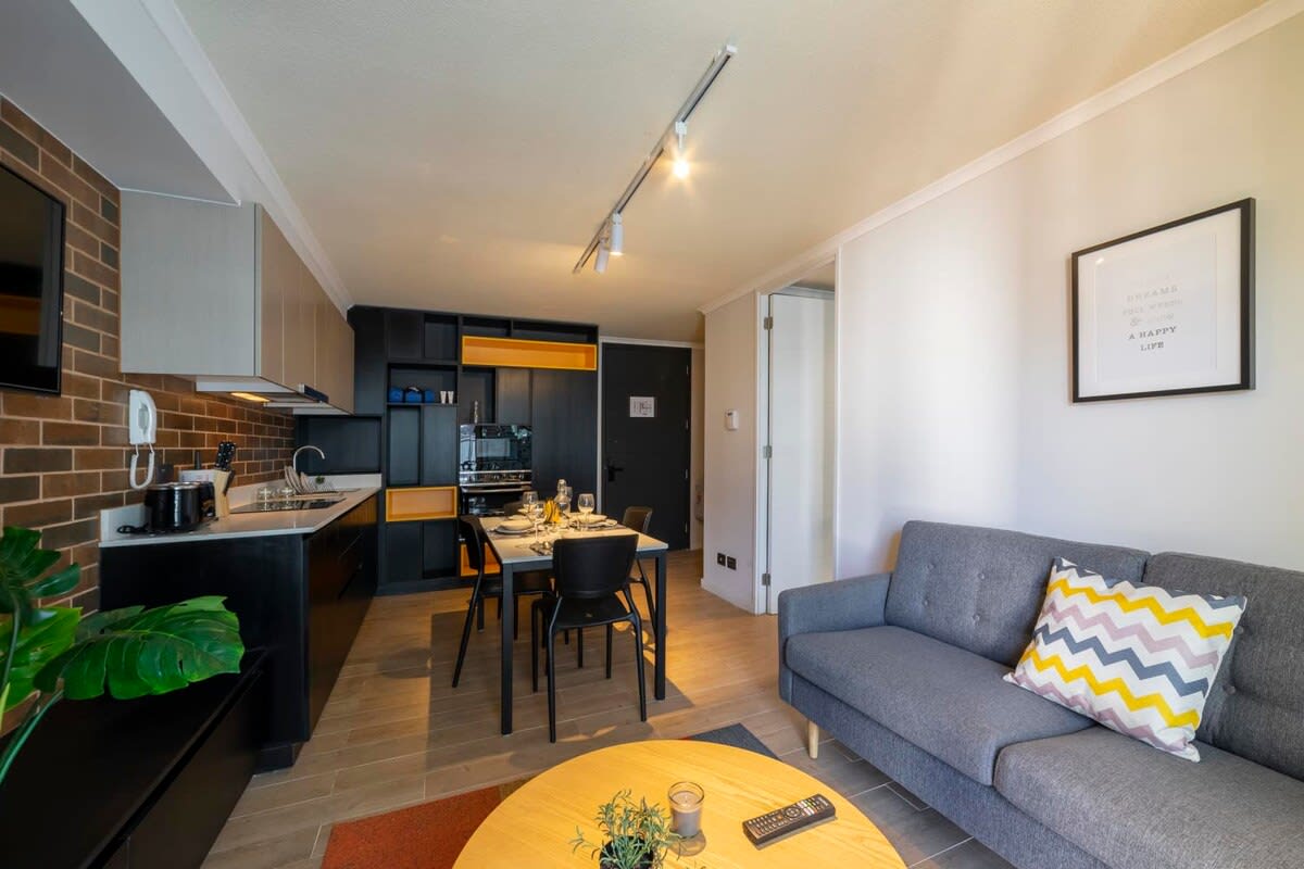 Experience modern comfort in this stylish studio with a cozy living area and fully-equipped kitchen, perfect for a relaxing stay.