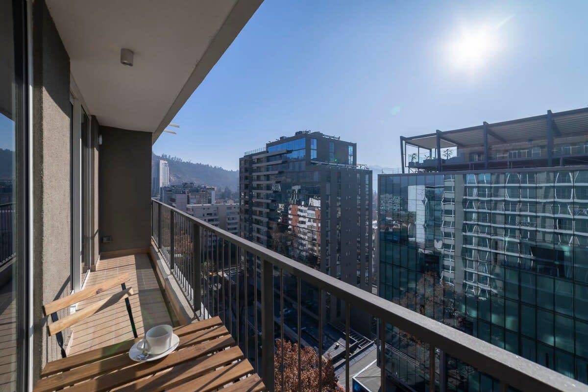Enjoy your morning coffee with stunning city views from this private balcony in the heart of Chile.