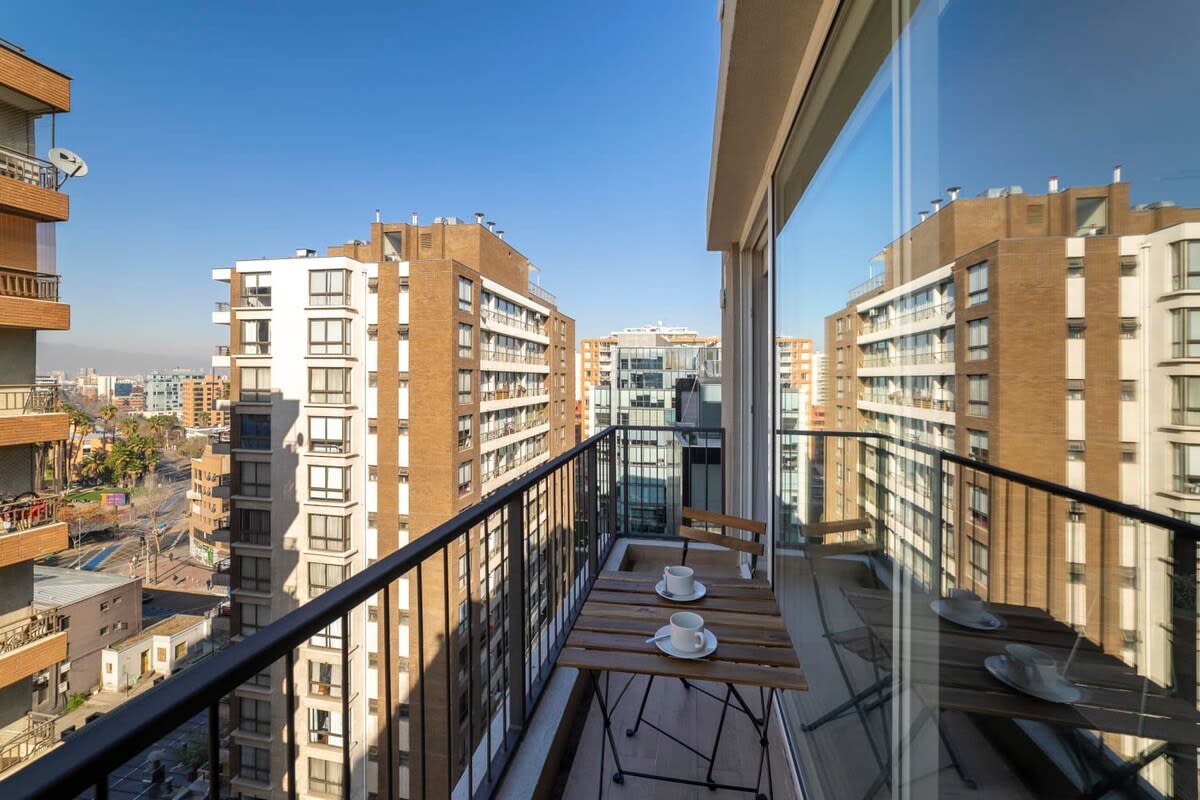Enjoy your morning coffee with stunning city views from this cozy private balcony.
