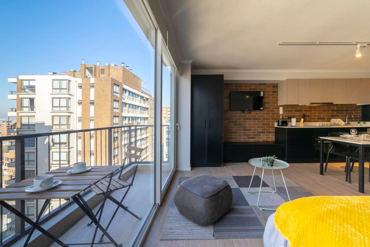 Enjoy stunning city views from this chic studio with a cozy balcony and modern amenities, perfect for a relaxing urban getaway.
