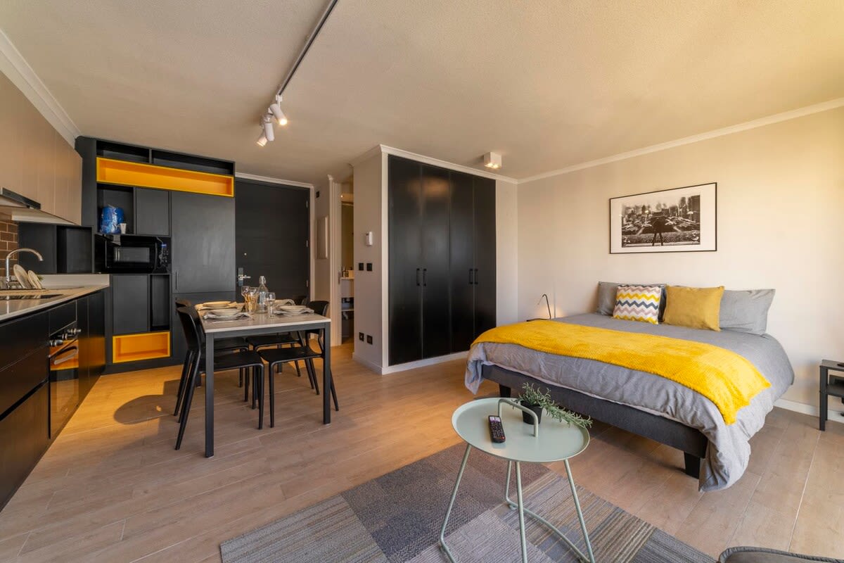 Chic studio with modern amenities and vibrant decor, perfect for a cozy stay in the heart of the city.