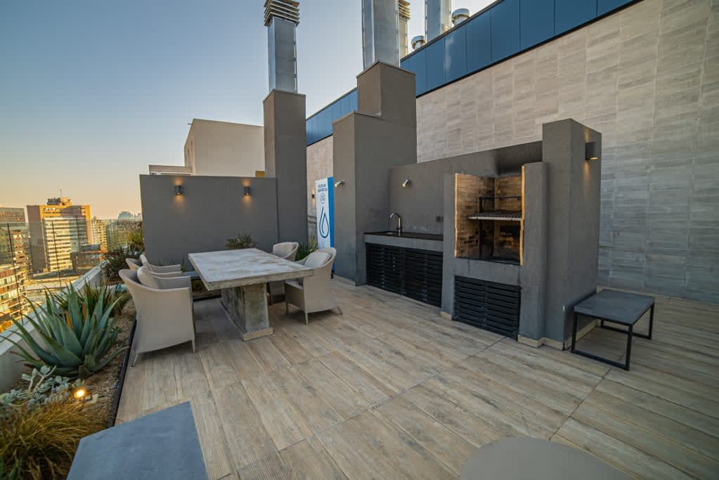 Enjoy breathtaking city views from this stylish rooftop terrace, complete with a dining area and BBQ grill.