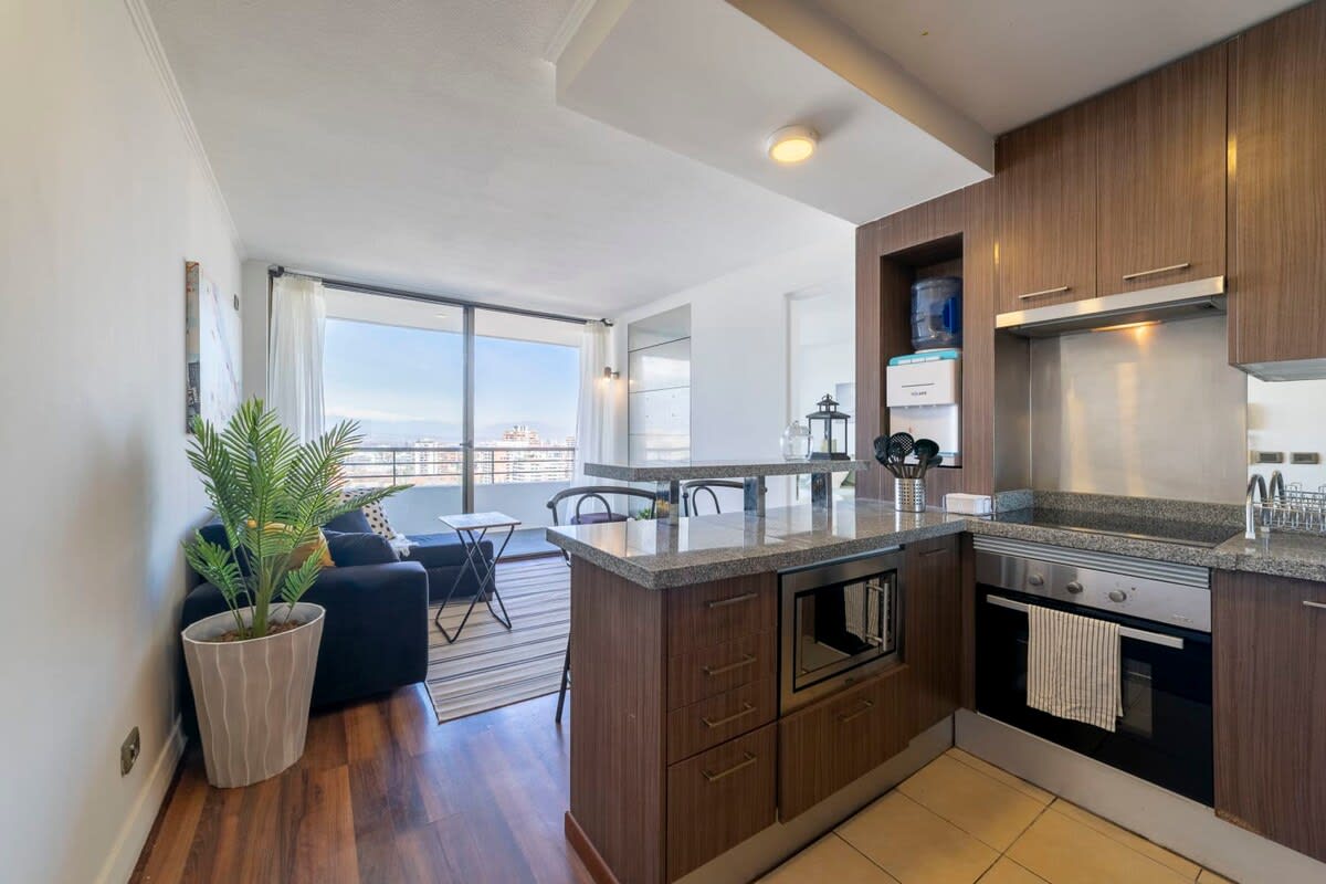 Espacio culinario de diseño abierto, ideal para compartir mientras cocinas