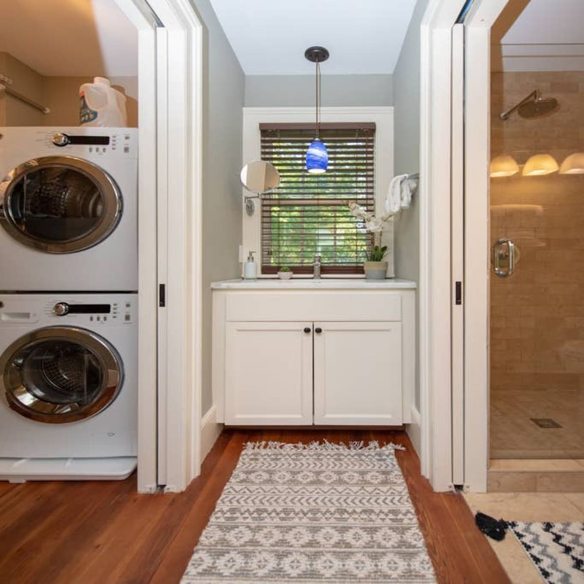 Brand new washer and dryer, adjacent to a full bath and shower