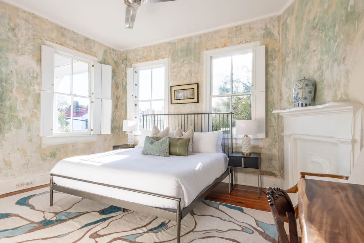 Welcome to your downtown Charleston rental! This is the master bedroom overlooking Spring Street 🙂 