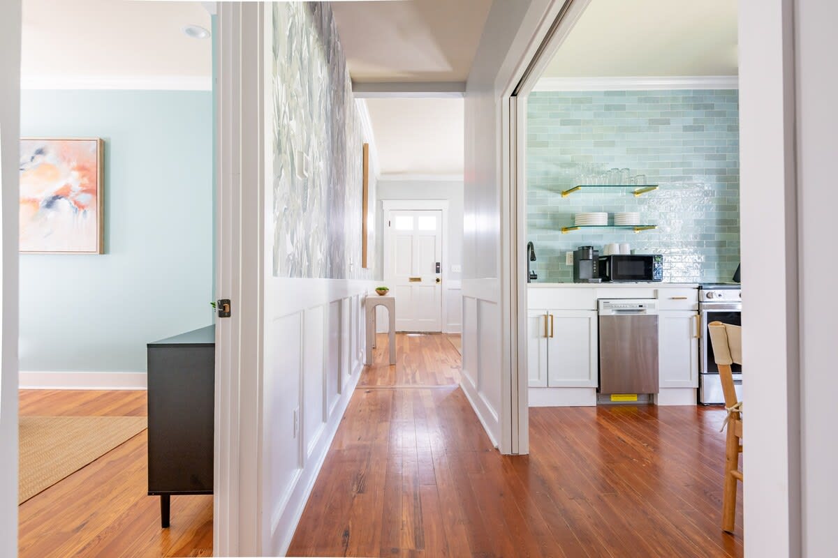 Entry hallway with the kitchen on the right and bedroom #1 on the left 