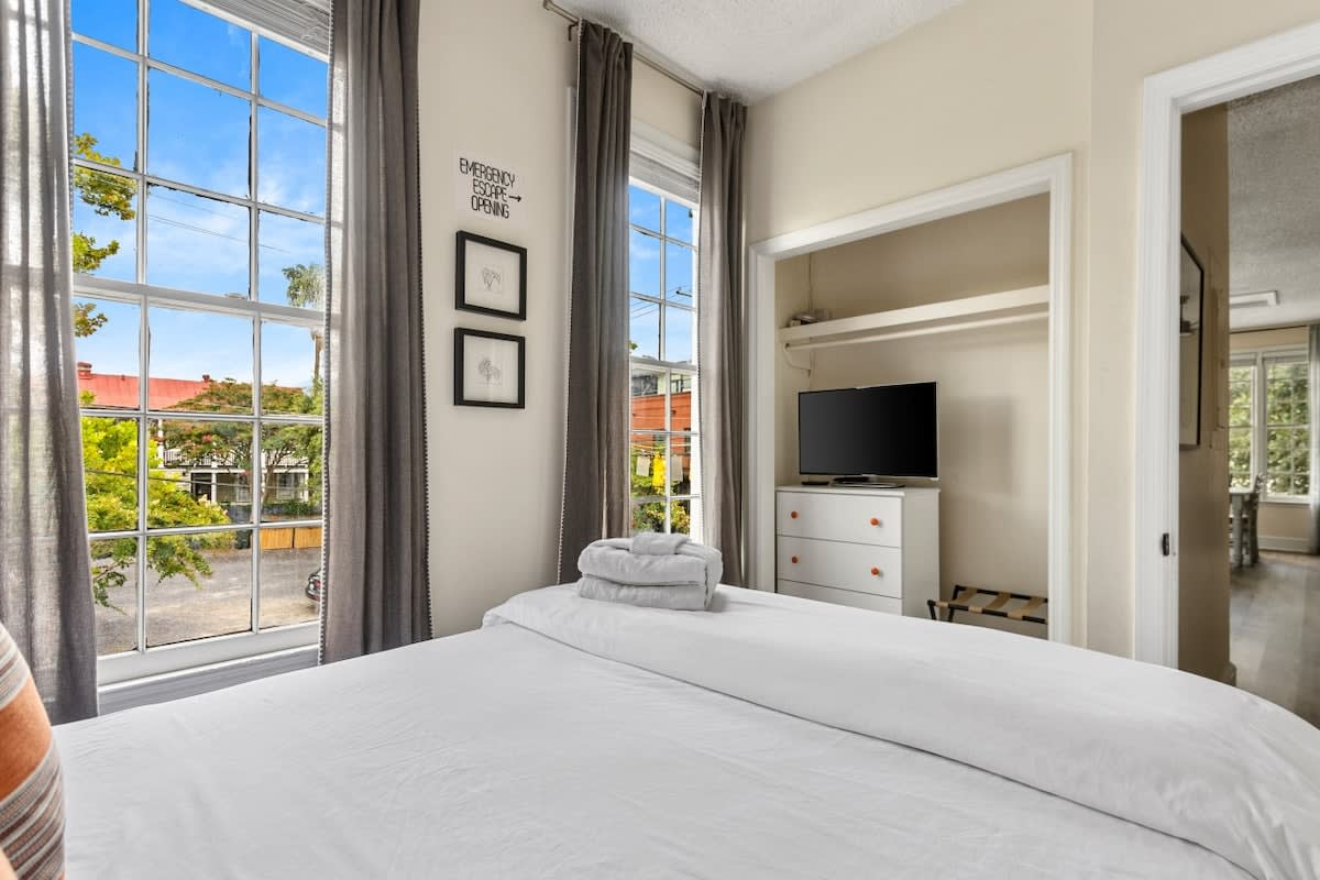 Bedroom #1 with a Queen Bed + TV + Ceiling Fan!