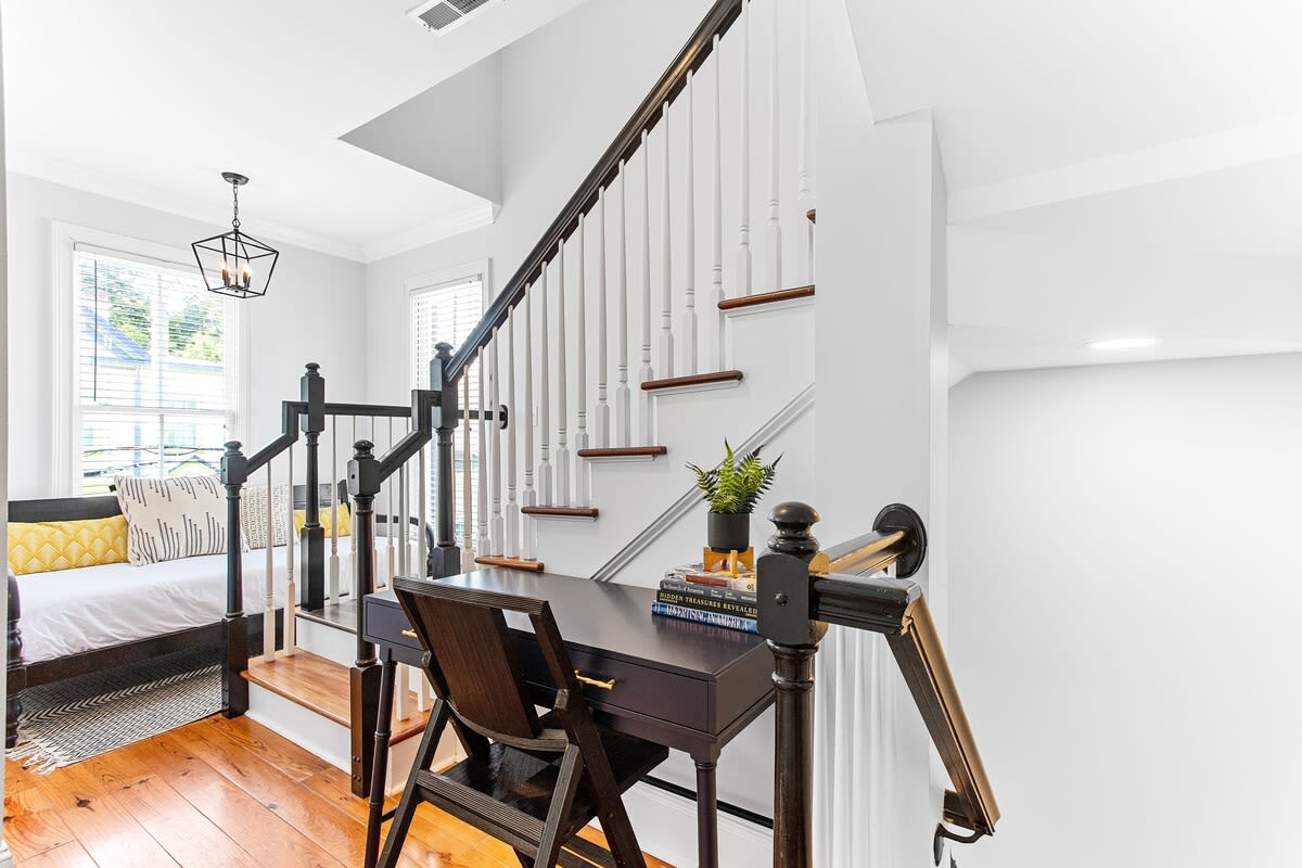 Stairway area with desk area and twin daybed. 