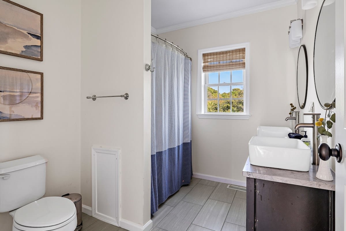 Bathroom #3 with a shower/tub combo + double vanity (hallway access for bedrooms 3 & 4)