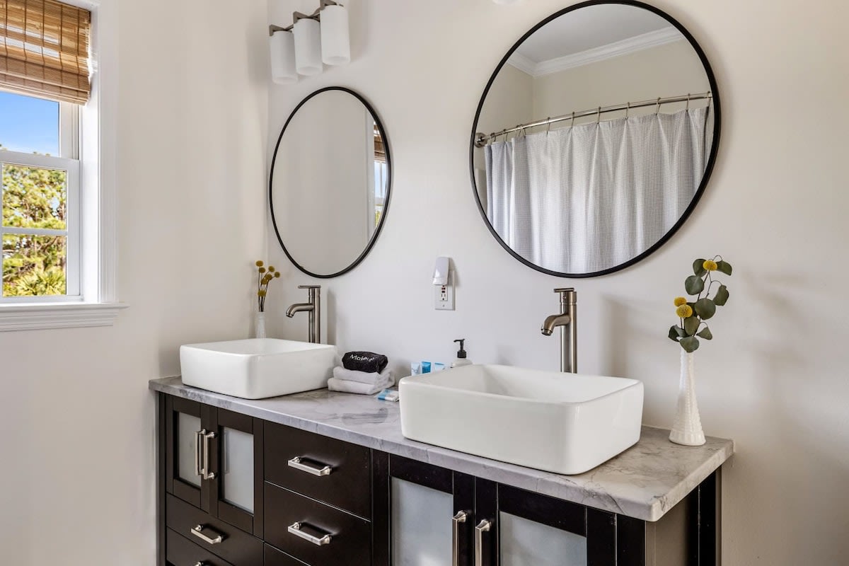 Bathroom #3 with a shower/tub combo + double vanity (hallway access for bedrooms 3 & 4)