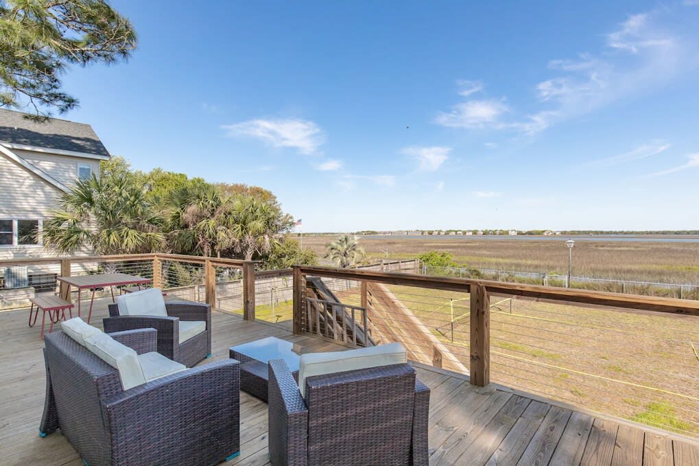 Large outdoor deck with seating and views of Folly Creek! 