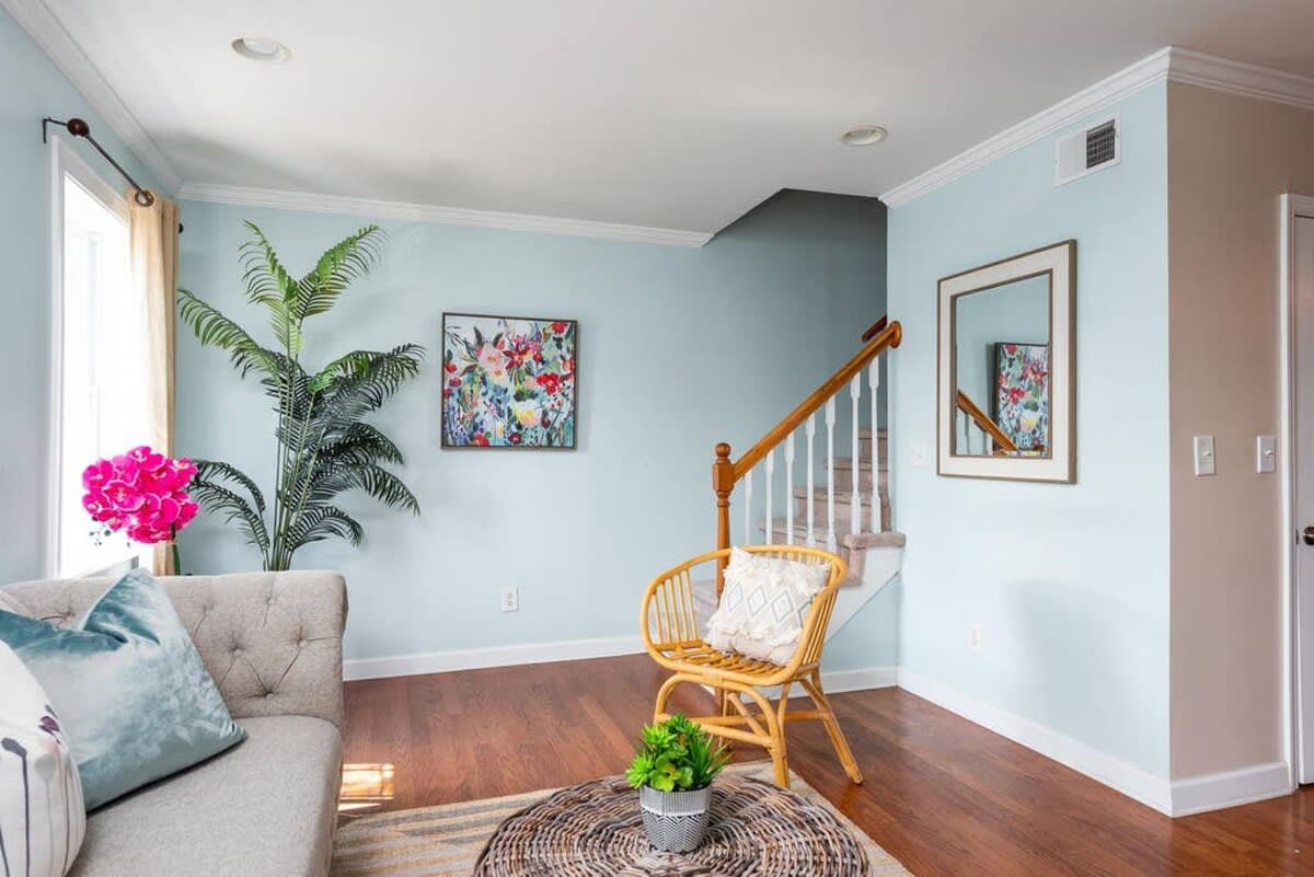 View of the living room leading to the stairs. Come join us on Island time!